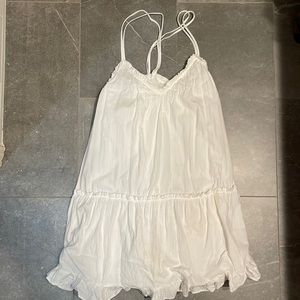 White babydoll dress with crossover back.